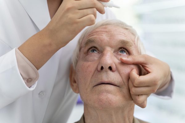 doctor-pouring-some-eye-drops-patient
